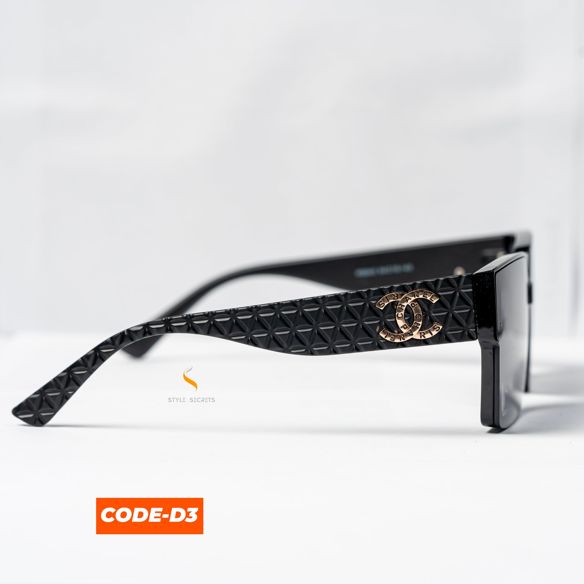 Chanel CODE-D3 sunglasses, showcasing a sleek, modern design with the iconic Chanel logo.

